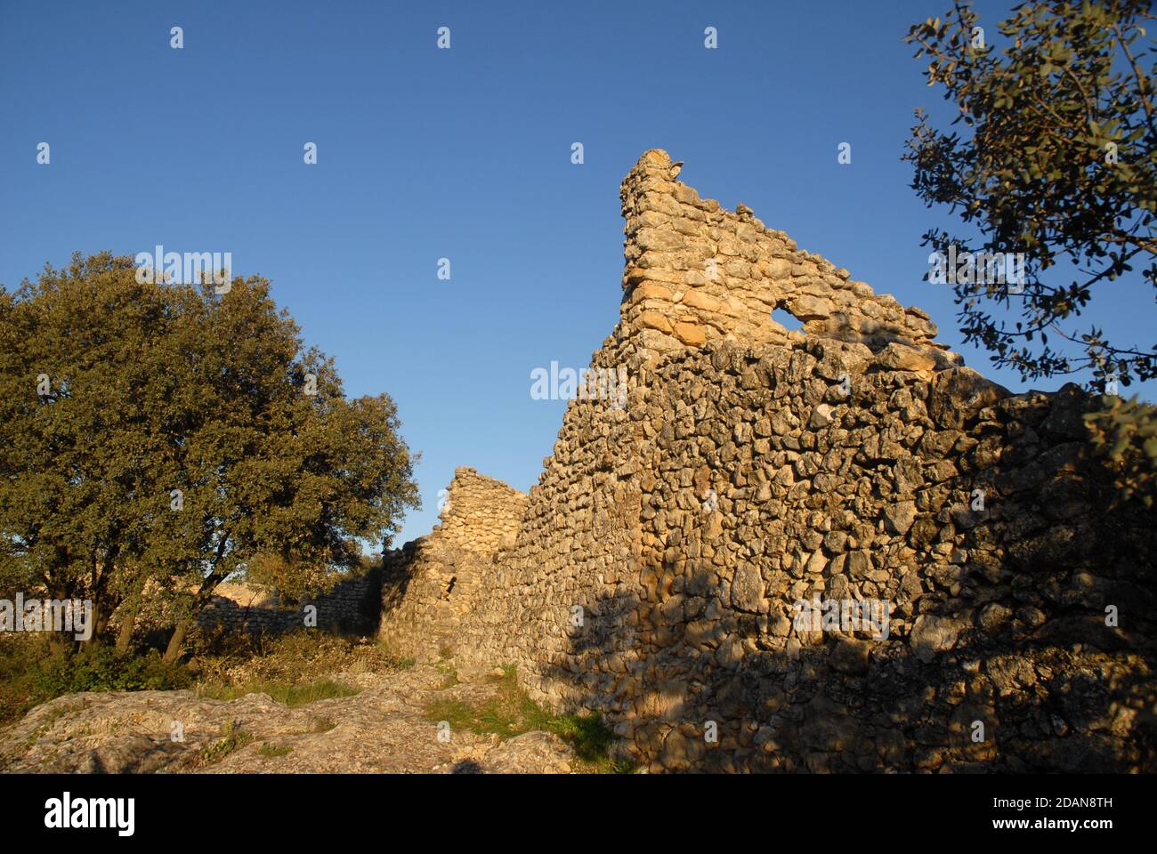 Crumbling stone walls and the ruins of the Moorish village of L`Atzuvieta in the Vall de Alcala, Alicante Province, Comunidad Valencia, Spain Stock Photo